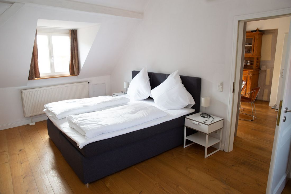 Gasthaus Zum Goldenen Hirsch - Schlafzimmer im Appartment 9